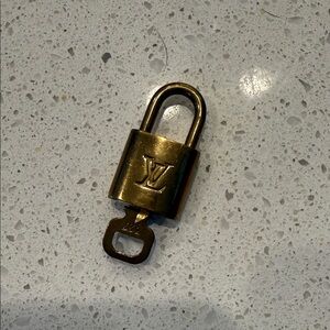 Louis Vuitton Brass Lock with LV Monogram